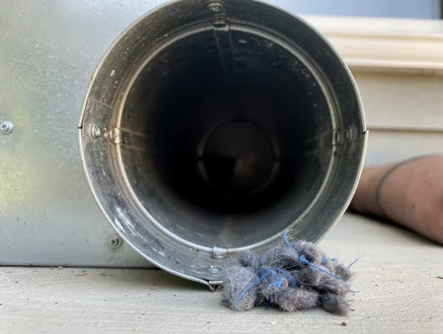 Bristol Dryer Vent Cleaning technician using specialized equipment to clear severe dryer vent blockage in Bristol